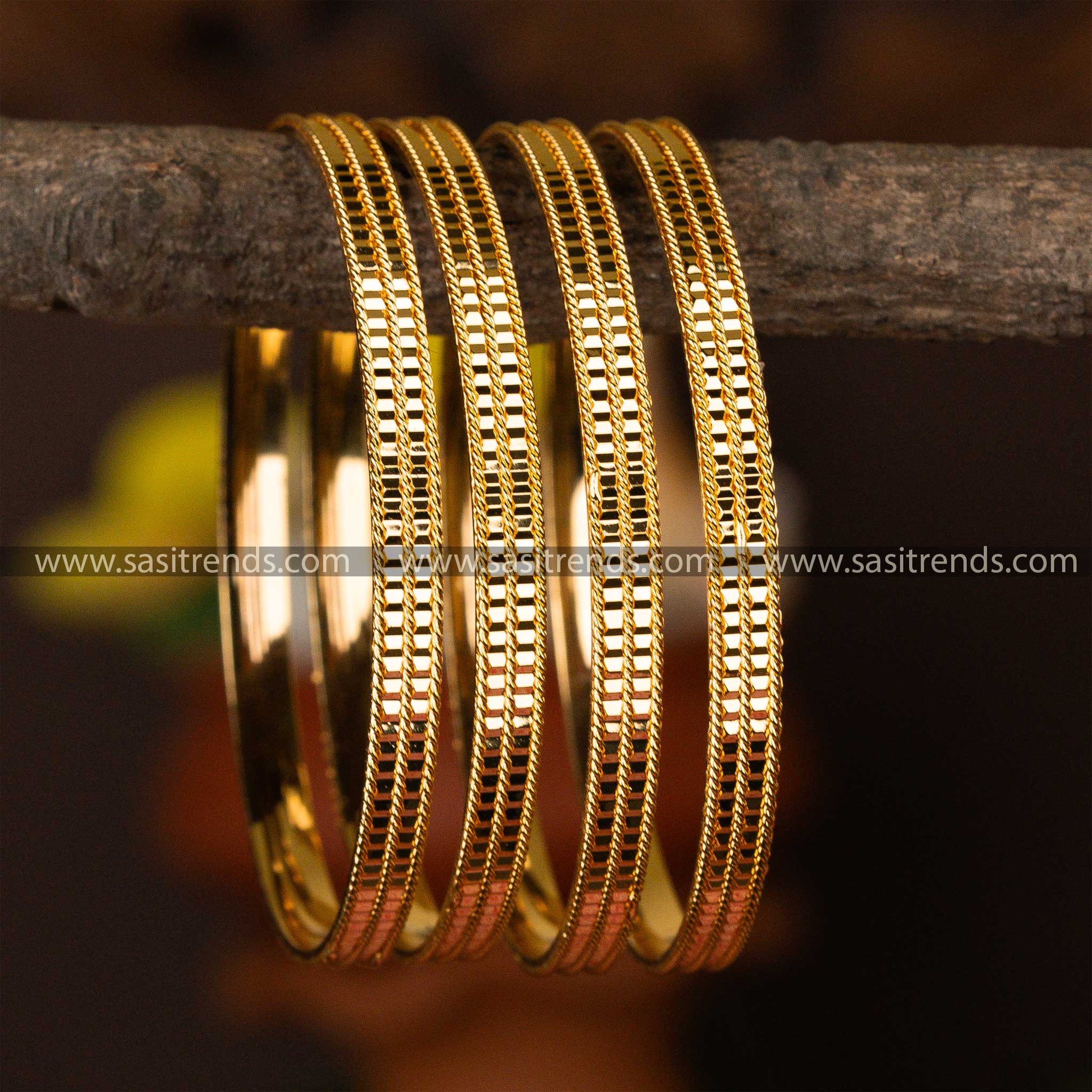 Set of four intricately textured micro gold-plated bangles