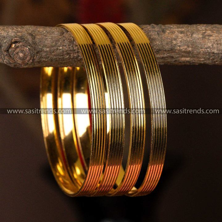 Set of four sleek micro gold-plated kada bangles with a luminous finish for everyday elegance.