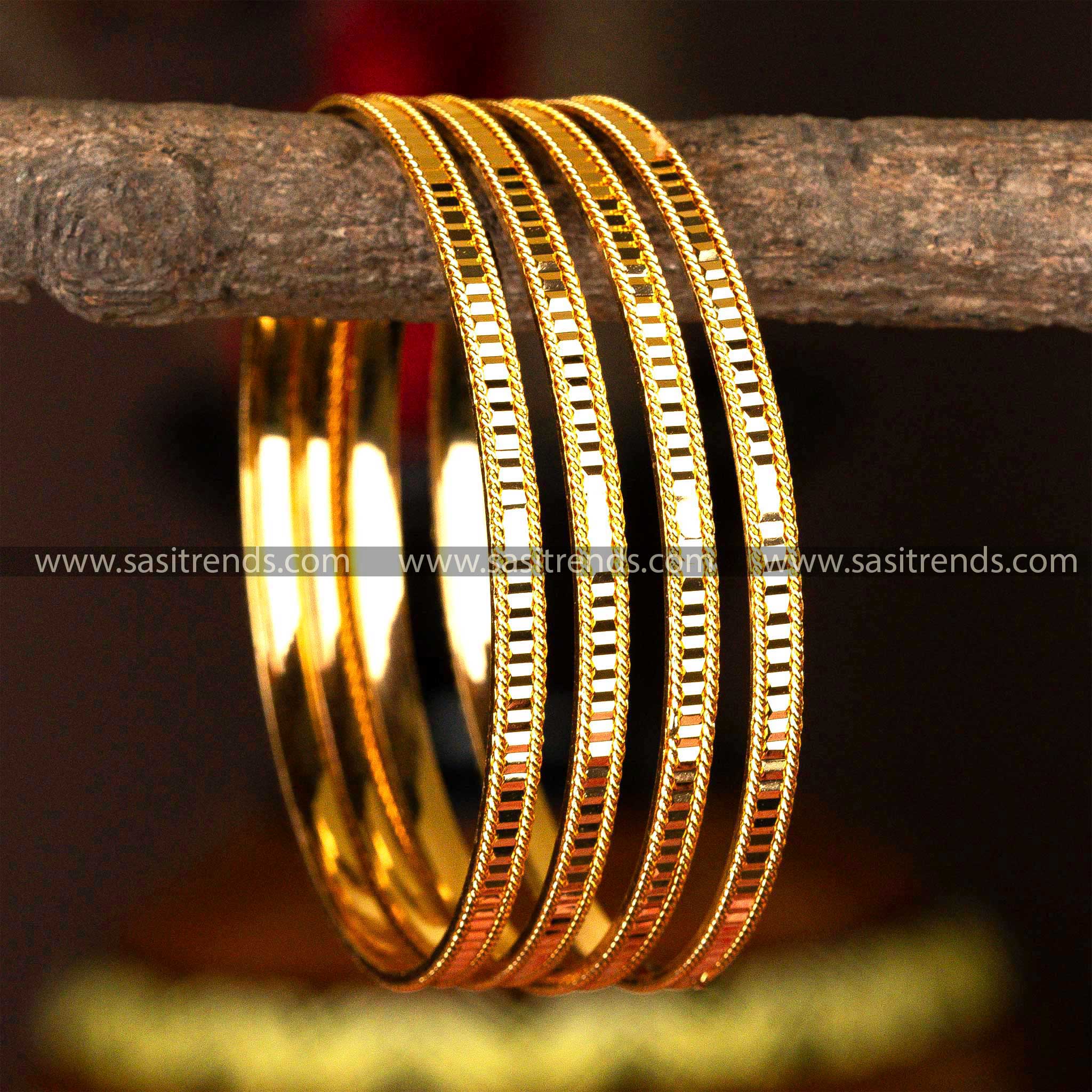 Set of four micro gold-plated kada bangles with a distinct grooved design for a refined look.