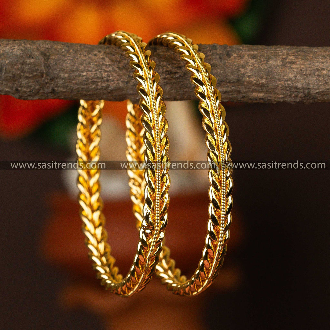 Shimmering micro gold-plated bangles on a rustic backdrop, exemplifying classic style.