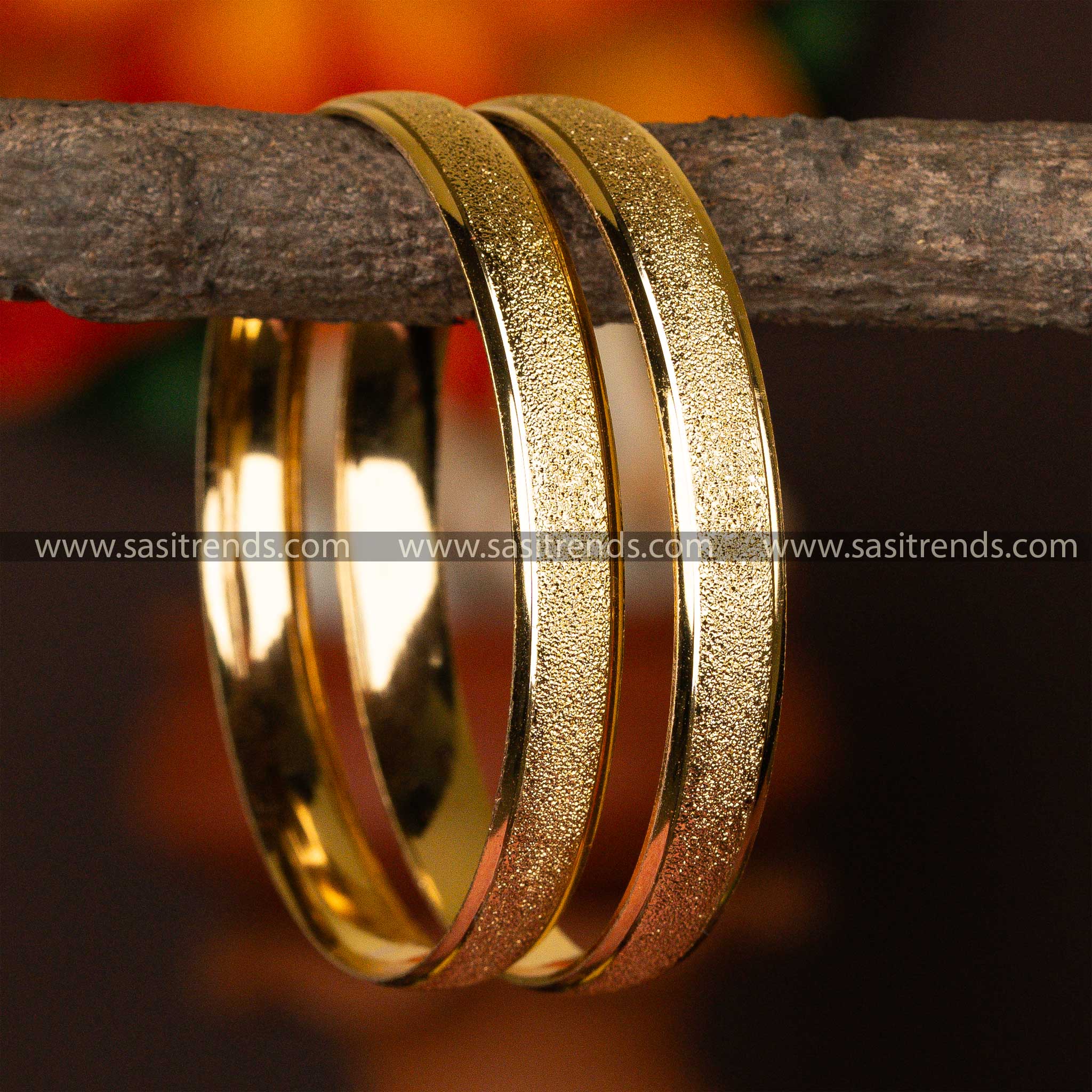 Micro gold-plated bangles with a unique frosted finish, embodying subdued glamour.