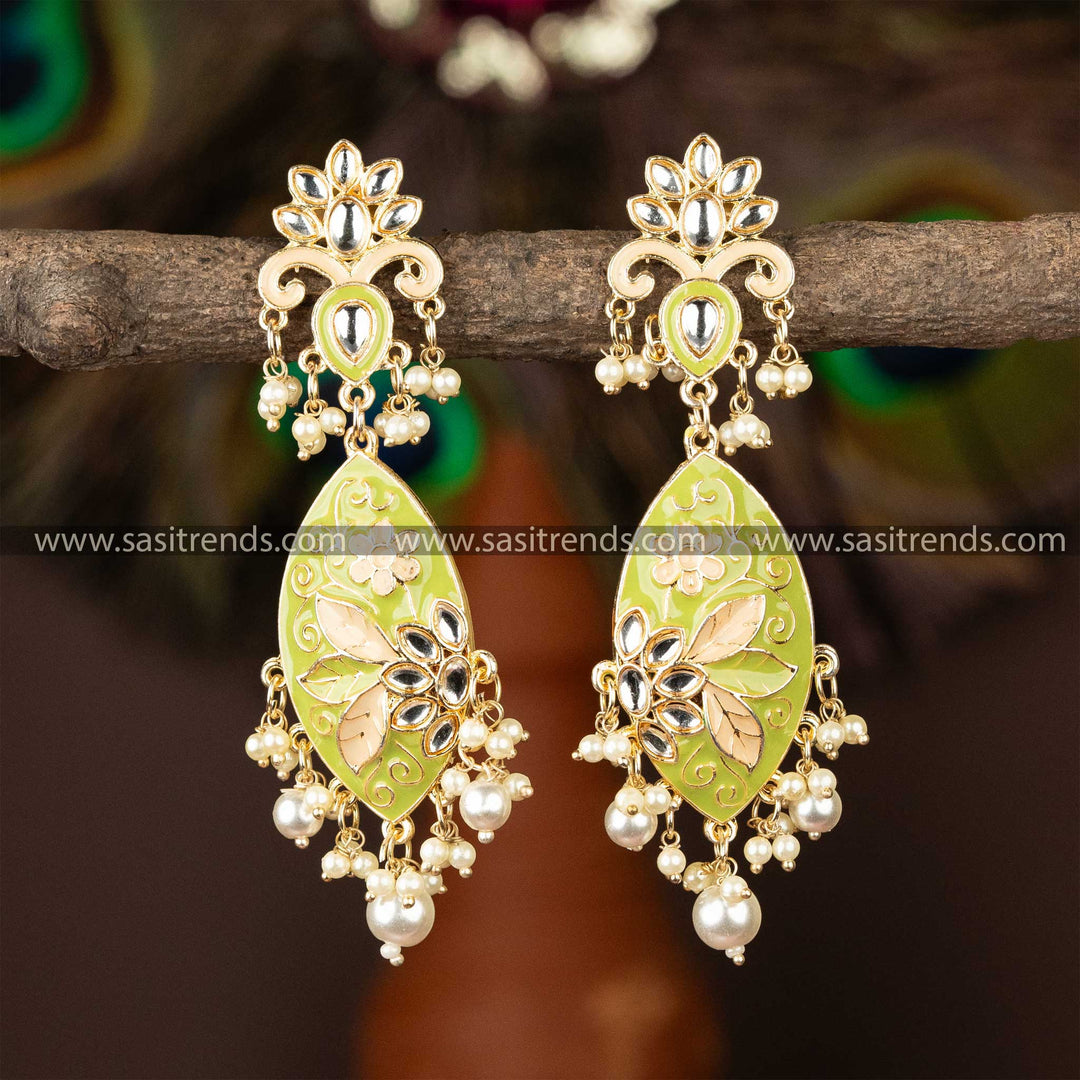 Gold-plated kundan earrings with vibrant green enamel and pearl accents.