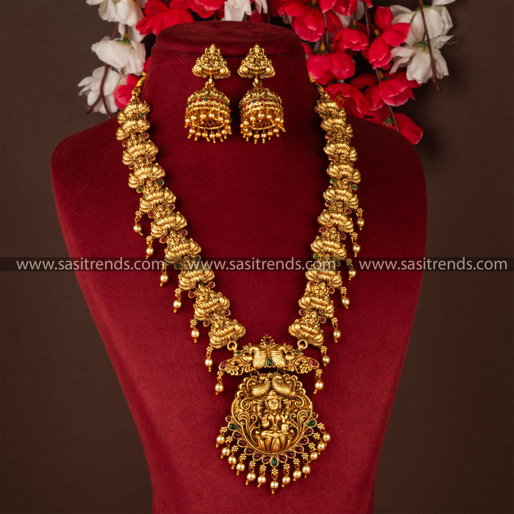 Divine: Classic Matt Gold Plated Lakshmi Pendant Long Necklace with Jhumka Jewellery Set