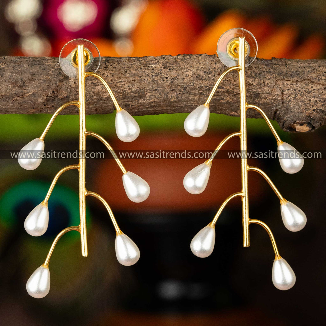 Gold-plated pearl earrings hanging in a branch-like design