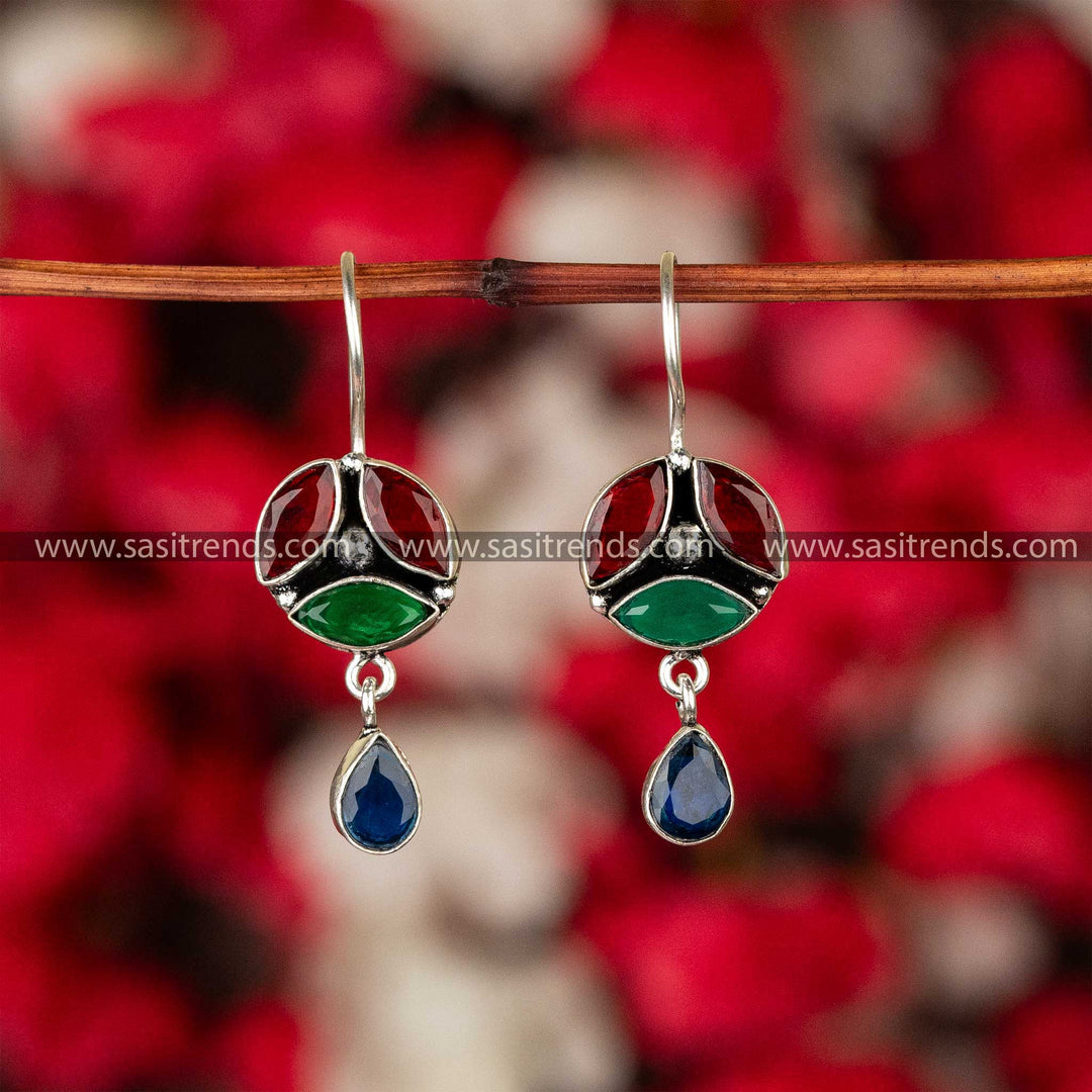 Tri-colored stone earrings with red, green, and blue stones on oxidised German silver