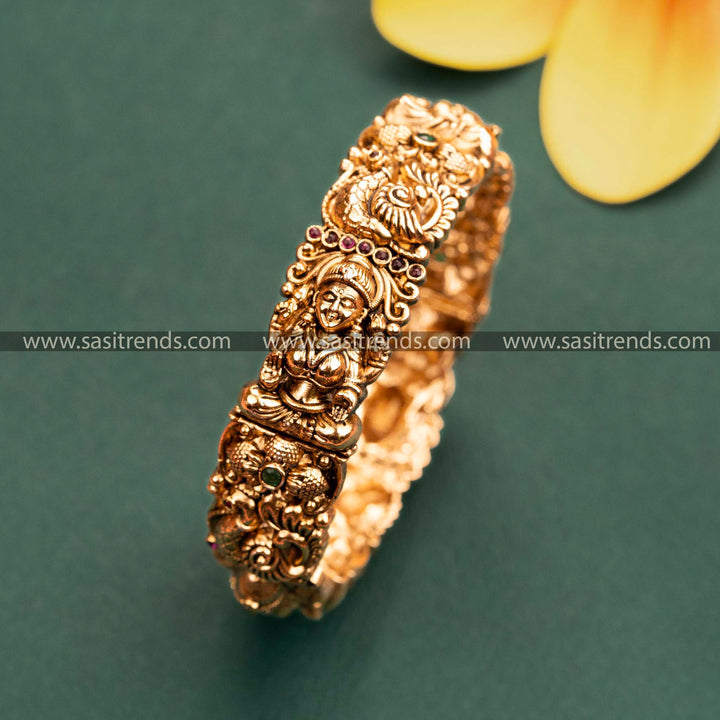 Gold Plated Lakshmi & Peacock Motif Kada Bangle with Ruby-Green Stones