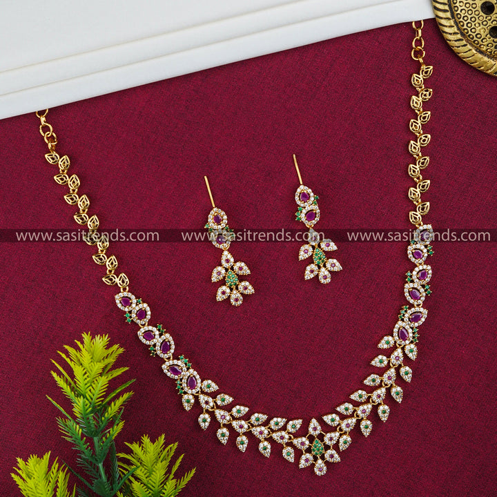 Temple Matte Gold Plated Leaf Motif Jewellery Set | Floral Tilak Design and American Diamond Stones