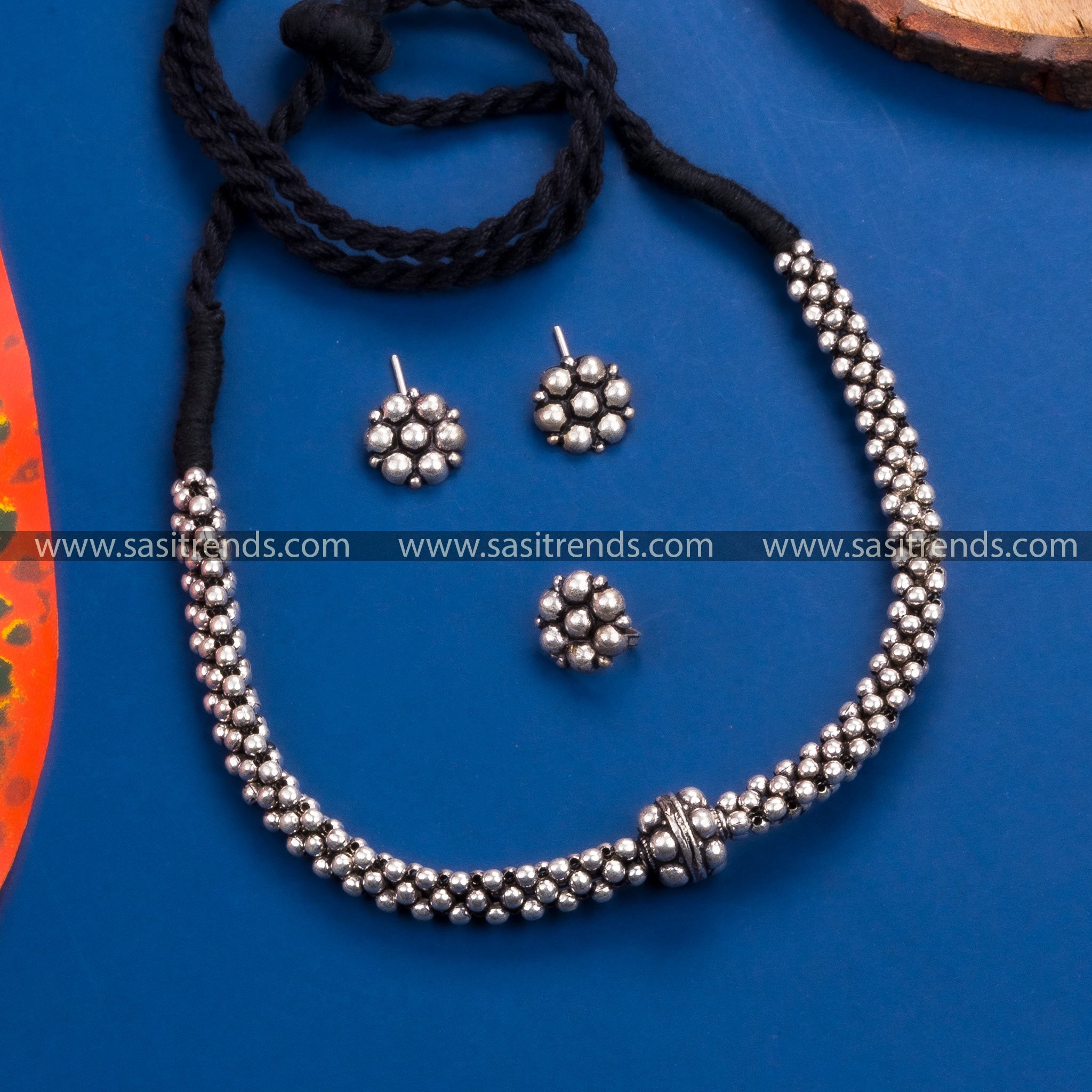 Kolhapuri oxidized silver necklace set with floral earrings and ring - perfect for parties and traditional occasions.