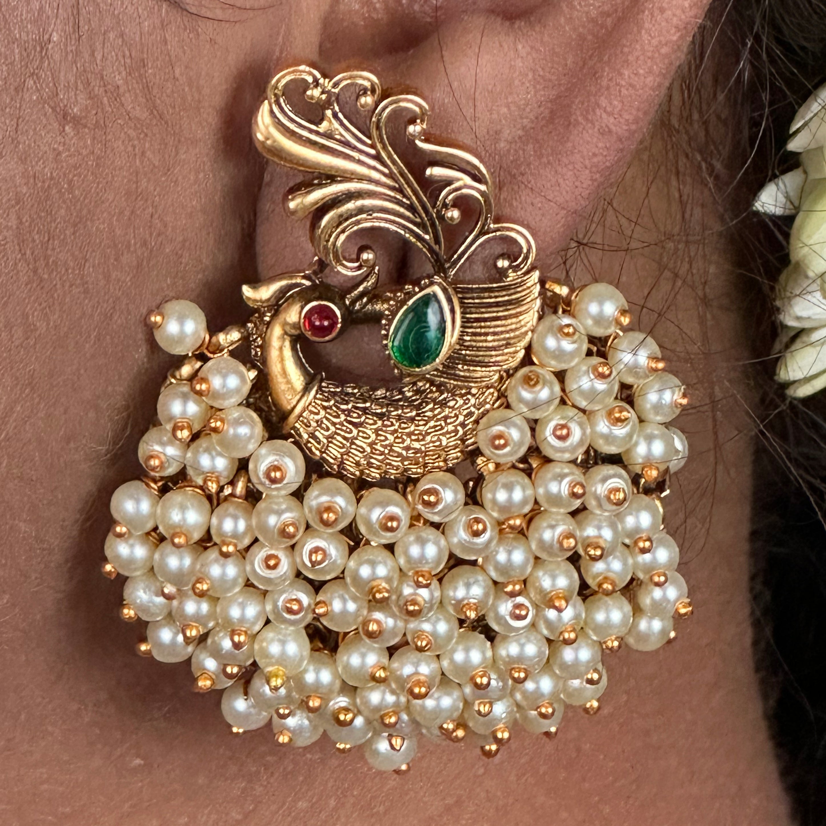 Elegant Peacock Feather Pearl Earrings - A cluster of pearls in a graceful peacock feather arrangement