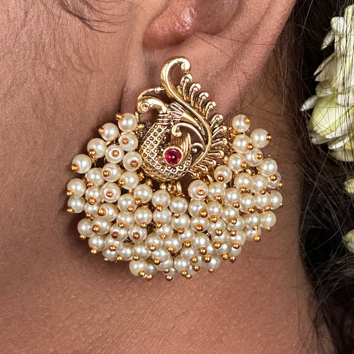 Opulent Pearl Bunch Earrings - Luxurious pearls forming a stunning peacock-inspired cluster.