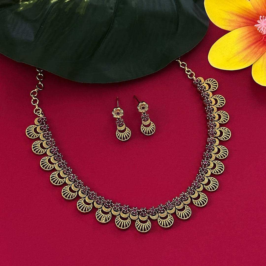 Elegant Floral and Moon Motif Necklace Set with American Diamond and Ruby Stones on Brass: A Radiant and Timeless Accessory