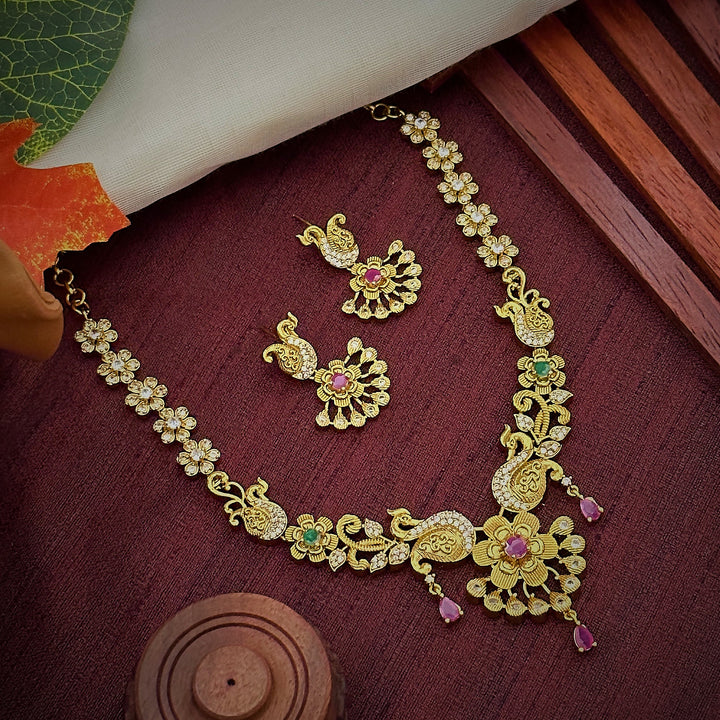 New Temple Matte Gold Tone Peacock and Flower Jewellery Set: Ruby Hangings and AD Stones