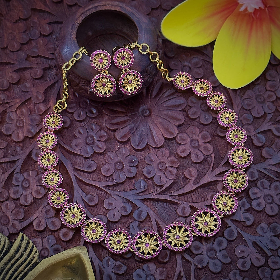 Close-up of Leaf Chakara Pattern Necklace Set: Intricate Design with Full Ruby Stone Center, Brass Material with Matte Gold Finish