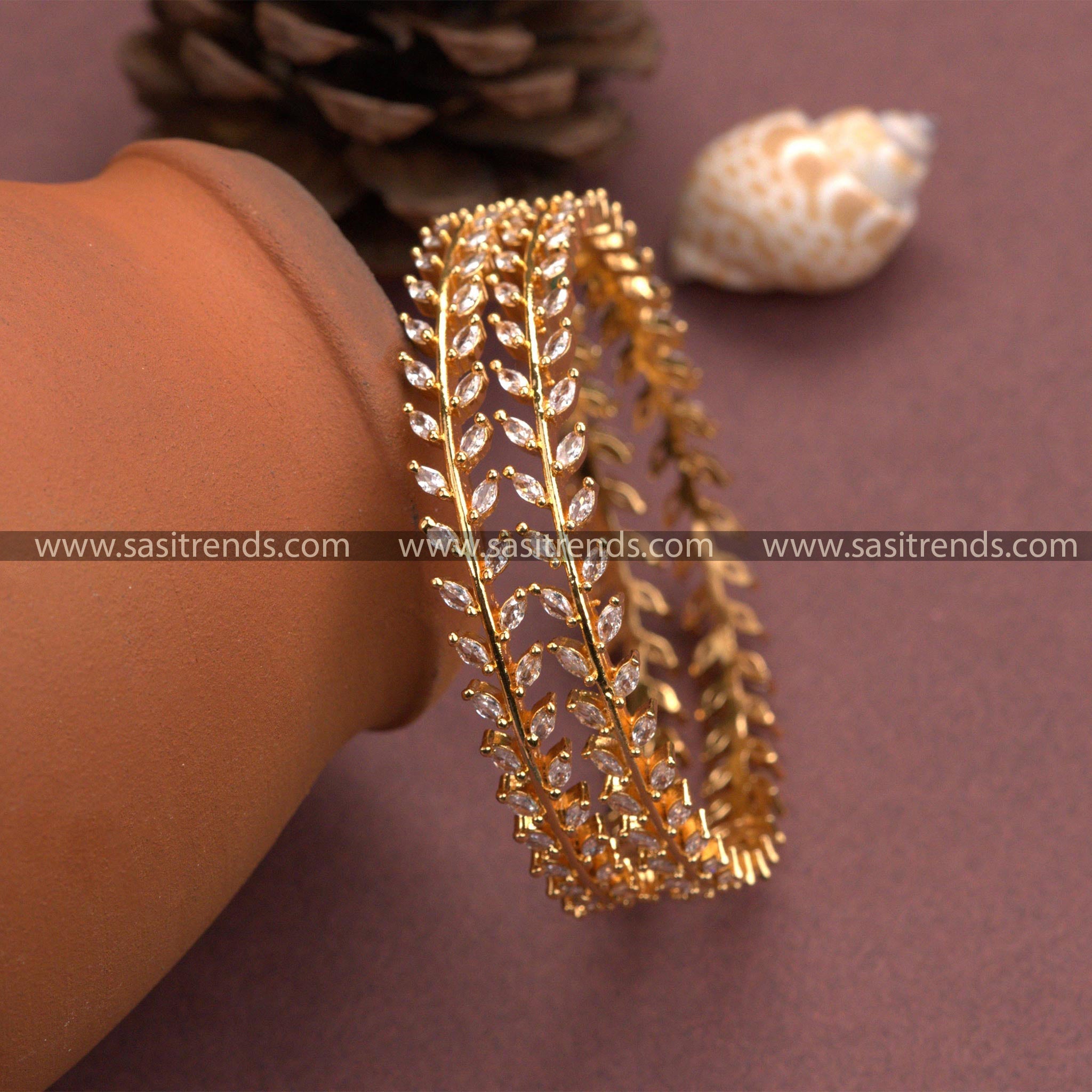 Traditional micro gold plated white AD bangles with multicolor American diamond stones, perfect for Diwali celebrations.