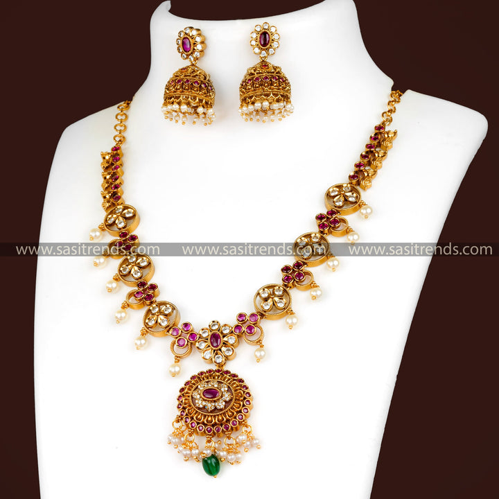 Matte Gold Necklace Set with Ruby Red and White Stones - Floral Pendant, Jhumkas, AD Stones, Hanging Pearls - Festival Jewelry for Women