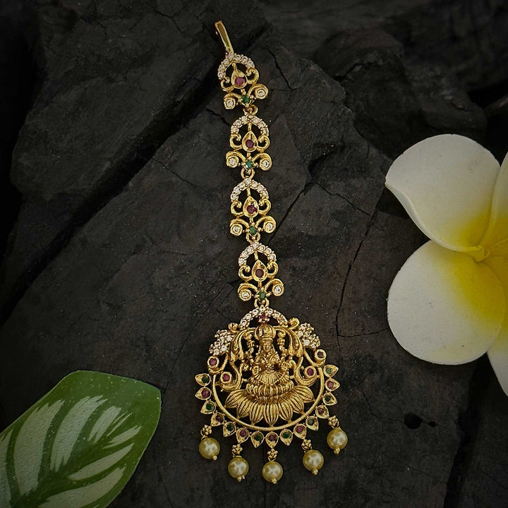 Lakshmi Motif Bridal Maang Tikka in Matte Gold Plated - Floral Design with AD Stones for a Stunning Look | Sasitrends