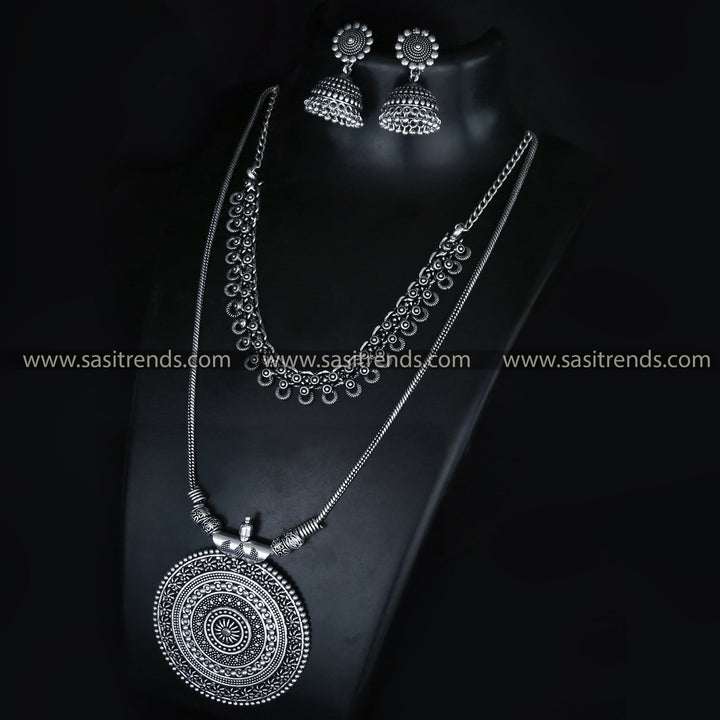 Roopasi Chakra Pendant Chain and Tanvi Oxidised Choker Jewellery Set with Floral Jhumka Earrings