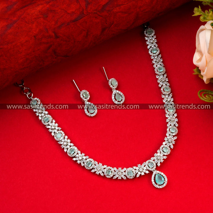 Elegant Party Wear Mint Green Color Rhodium Silver Plated AD Necklace Set with Floral and Oval Patterns