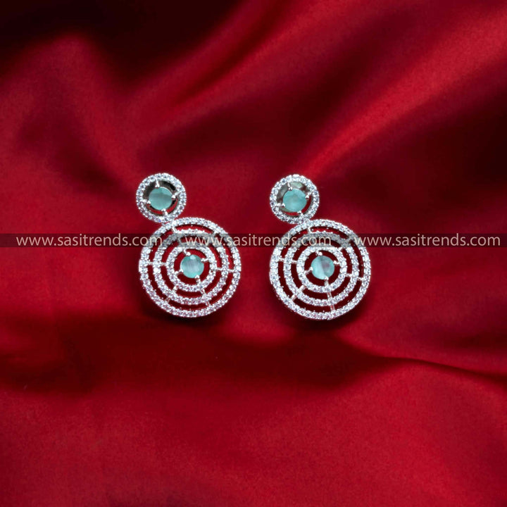 Stunning rhodium silver plated earrings with circle pattern, colored round stone, and AD stones.