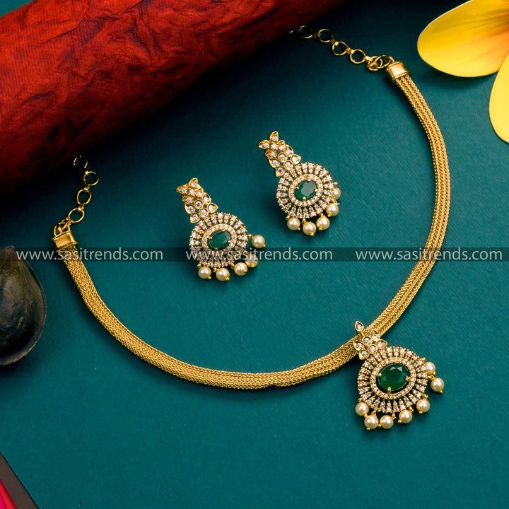 Matte Gold Plated Attigai Necklace: Traditional Stylish Choker with Green Stone Floral Pendant & Pearl Drops