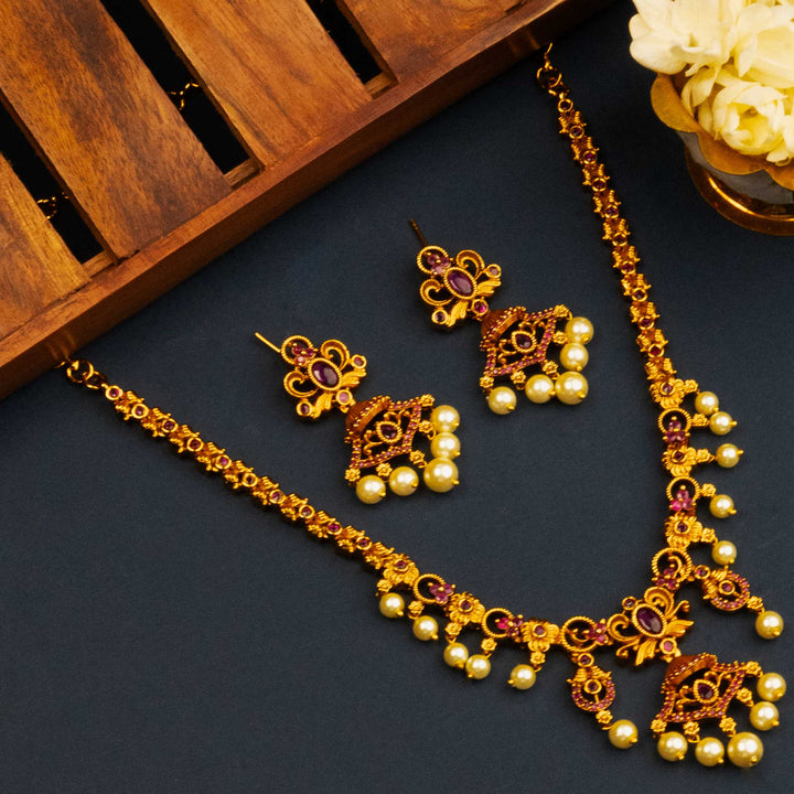 Traditional Matte Gold Plated Temple Floral Pearl Jewellery Set with American Diamond Pendant