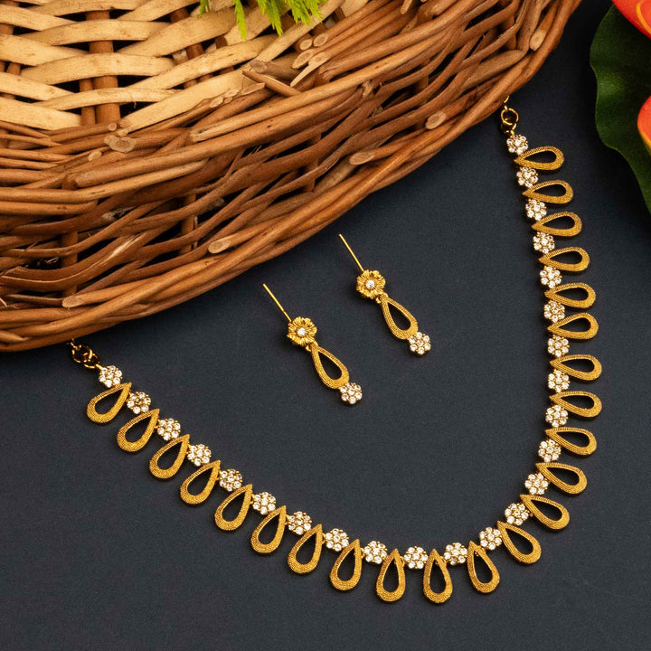 Exquisite Temple Matte Gold Plated Jewellery Set with American Diamond Stones